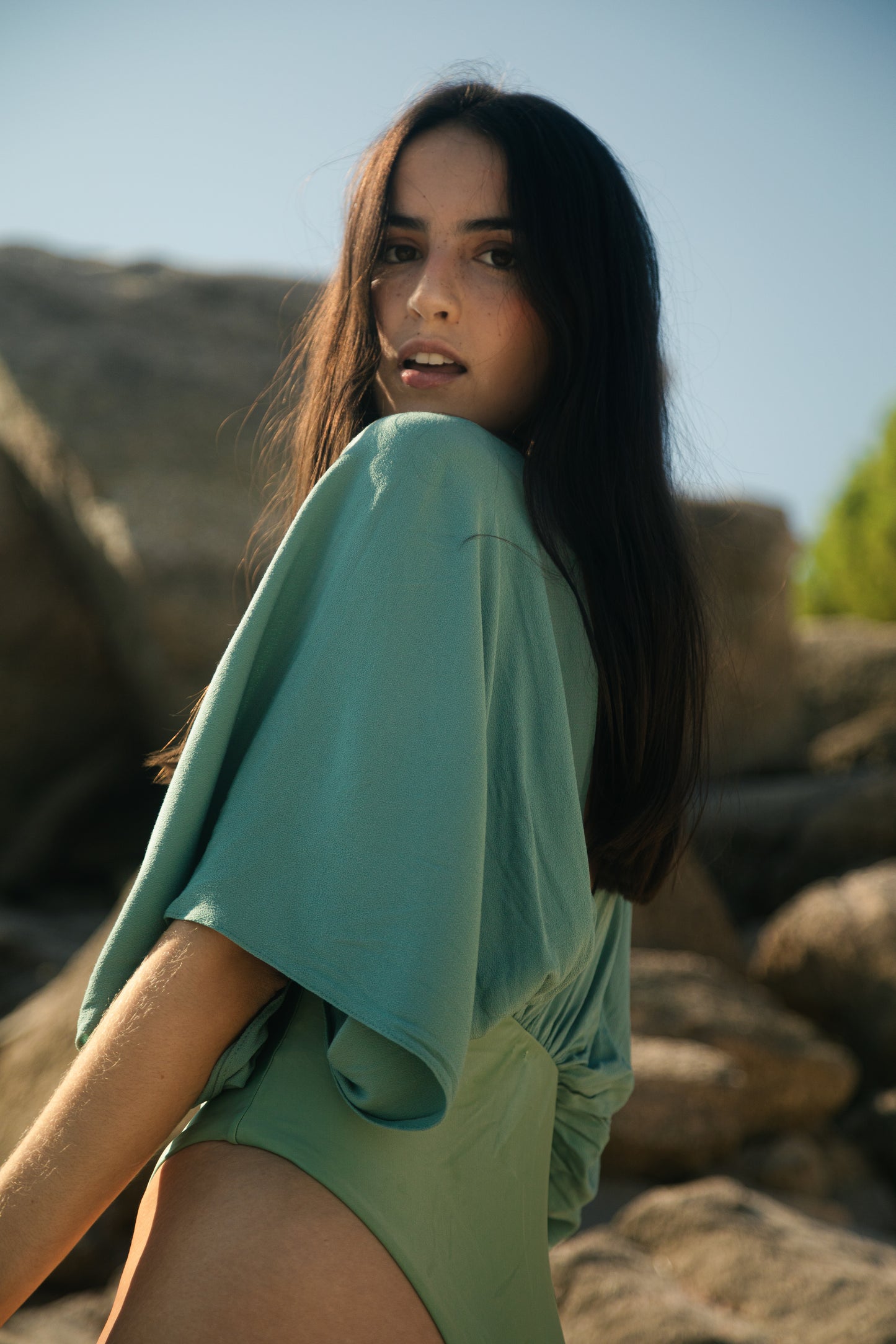 Light green swimsuit with sleeves, onepiece